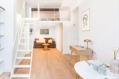 a living room with a staircase and a couch at The Calypso - Quiet - New - Central in Nice