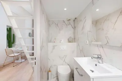 a white bathroom with a sink and a toilet at The Calypso - Quiet - New - Central in Nice