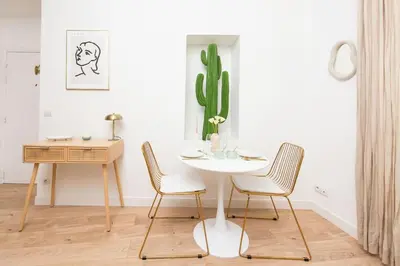 a dining room with a table and chairs and a cactus at The Calypso - Quiet - New - Central in Nice