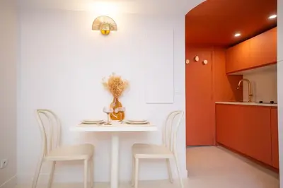 a kitchen with a white table and two chairs at The Calypso - Quiet - New - Central in Nice