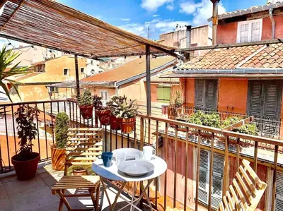 a balcony with a table and chairs on a building at #30 Old Town, Castle panoramic View / Terrace & AC in Nice