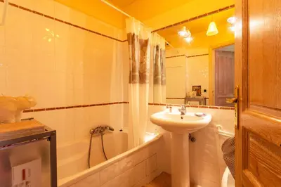 a bathroom with a sink and a toilet and a tub at LA CASA AP4409 By Riviera Holiday Homes in Villefranche-sur-Mer