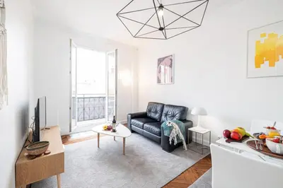 a living room with a couch and a tv at MY CASA - MEDECIN 43 - Superb Bright City Center Apartment in Nice