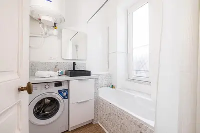 a white bathroom with a washing machine and a tub at MY CASA - MEDECIN 43 - Superb Bright City Center Apartment in Nice