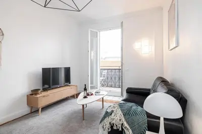 a living room with a couch and a tv at MY CASA - MEDECIN 43 - Superb Bright City Center Apartment in Nice