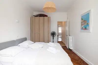 a bedroom with a white bed with white pillows at MY CASA - MEDECIN 43 - Superb Bright City Center Apartment in Nice