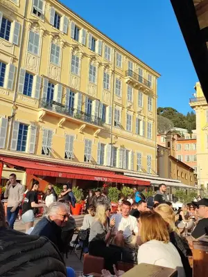 a group of people sitting in front of a building at Beau studio meublé hyper centre Nice in Nice