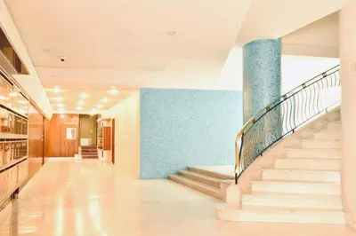 a hallway with stairs and a blue wall at 1 bedroom Brand new flat in the heart of Nice quartier des Musiciens in Nice