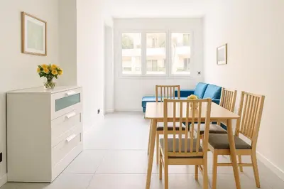 a kitchen and dining room with a table and chairs at 1 bedroom Brand new flat in the heart of Nice quartier des Musiciens in Nice
