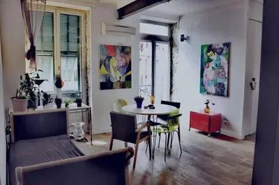 a kitchen and dining room with a table and chairs at Nice - Stylish apartment downtown in Nice