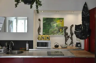 a kitchen with a sink and a microwave on a counter at Nice - Stylish apartment downtown in Nice