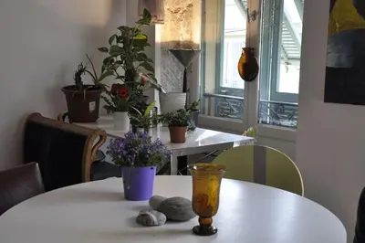 a white table with flowers and plants on it at Nice - Stylish apartment downtown in Nice
