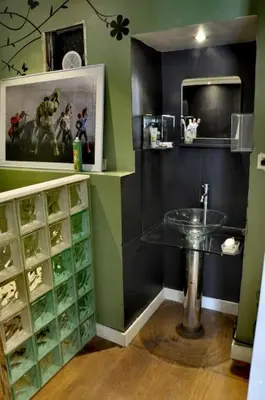 a bathroom with a glass sink and a mirror at Nice - Stylish apartment downtown in Nice