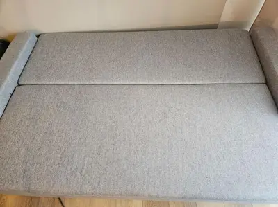 a close up of a couch in a room at Le plein ciel Studio in Nice