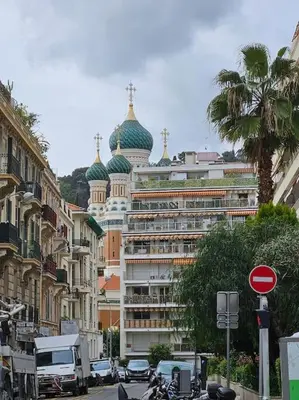 a large building with green domes on a city street at Le plein ciel Studio in Nice