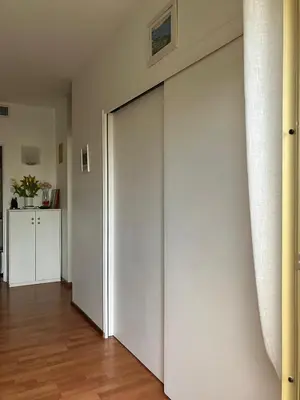 a large white sliding door in a room at Beaulieu in Beaulieu-sur-Mer