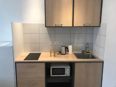 a small kitchen with a sink and a microwave at Appartement Nice proche de Monaco in Nice