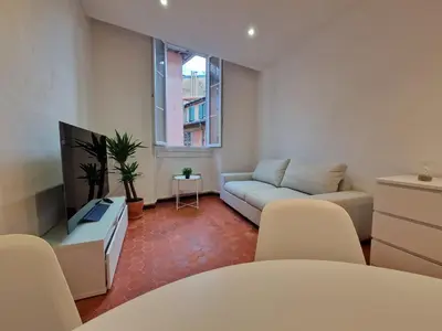 a living room with a couch and a tv at Sublime appartement 4P classé dans le Vieux-Nice in Nice