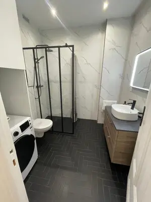 a bathroom with a shower and a toilet and a sink at Appart Cosy, Proche Gare in Nice