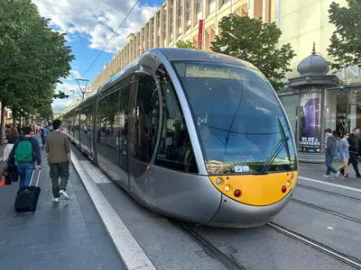 a train is on the tracks in a city at STUDIO REFAIT A NEUF CENTRE DE NICE in Nice