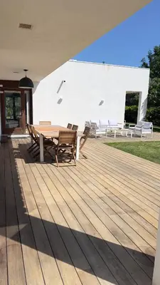 a white house with a tree in front of it at Magnifique Villa Moderne Avec Piscine in La Gaude