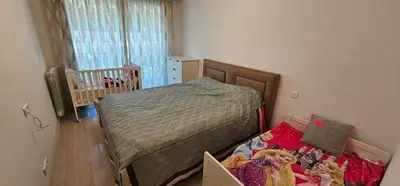 a small bedroom with a bed and a crib at bella d'azur in Nice