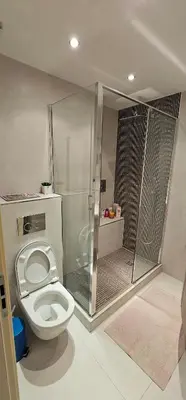 a bathroom with a toilet and a shower stall at bella d'azur in Nice