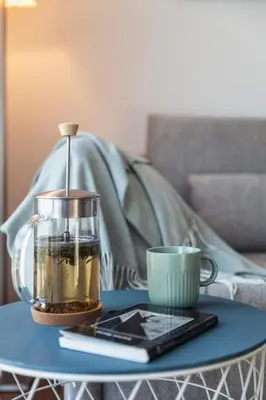 a table with a coffee pot and a cup on it at Appartement in Carros