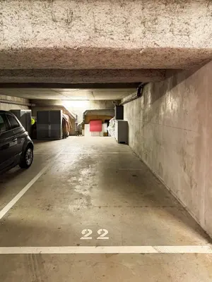 a parking garage with a car parked in it at Appartement in Carros