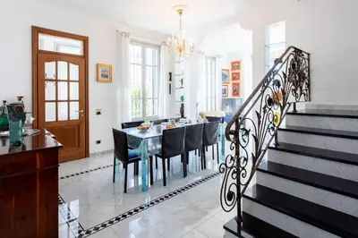 a dining room with a table and chairs at #15 Sea front Villa AC stunning view for 6 pers wifi in Nice