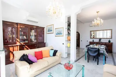 a living room with a couch and a table at #15 Sea front Villa AC stunning view for 6 pers wifi in Nice