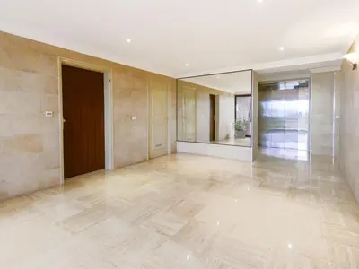 an empty room with a door and a mirror at Apartment Les Balcons d'Eze-3 by Interhome in Èze