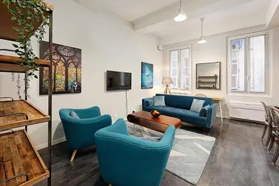 a living room with blue chairs and a table at #18 Rossetti Suite 2 Bedrooms , Central Old Nice/AC in Nice