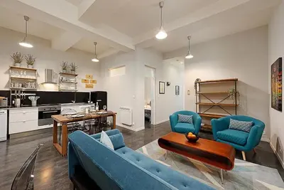 a living room with a blue couch and chairs at #18 Rossetti Suite 2 Bedrooms , Central Old Nice/AC in Nice