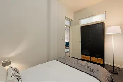 a bedroom with a bed and a large window at #18 Rossetti Suite 2 Bedrooms , Central Old Nice/AC in Nice