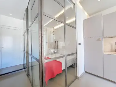 a bathroom with a large glass wall at Nestor&Jeeves - COEUR DAZUR - Central - Modern in Nice