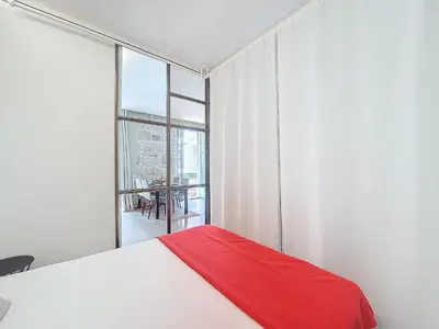 a white bedroom with a red blanket on a bed at Nestor&Jeeves - COEUR DAZUR - Central - Modern in Nice
