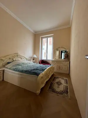 a bedroom with a bed and a mirror and a window at Appartement Nice Port Lympia Wifi Top Location in Nice