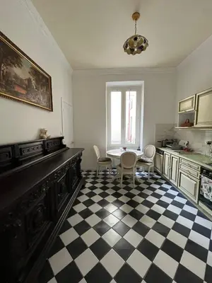 a room with a black and white checkered floor at Appartement Nice Port Lympia Wifi Top Location in Nice