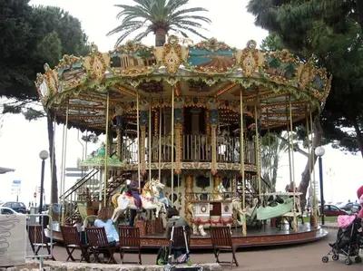 a carousel with people riding on it at Luxury apartment on Promenade des Anglais in Nice in Nice