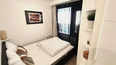 a small room with a bed and a window at Dana centre mer 25 in Nice