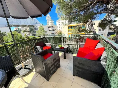 a living room with a couch and a kitchen at ⁂ Studio cosy 3 min de la plage terrasse clim in Nice