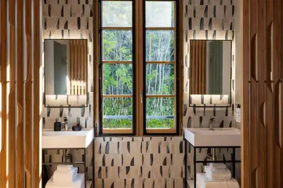 a bathroom with two sinks and two windows at Palais Ségurane Boutique Hôtel in Nice
