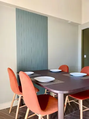 a dining room with a table and chairs at Appartement moderne avec une belle vue in Nice