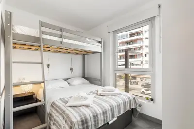 a bedroom with a bunk bed and a window at Loft Le Galet FSHH in Nice