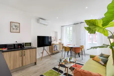 a living room with a couch and a table at L26 Old Town central 5mins walk to Sea front AC WIFI in Nice