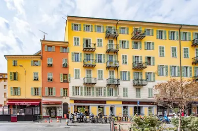 a yellow building with people standing outside of it at L26 Old Town central 5mins walk to Sea front AC WIFI in Nice