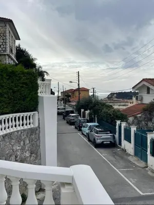 a street with cars parked on the side of the road at Fully equiped newly refurbished studio with an incredible view in Nice in Nice