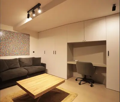 a living room with a couch and a table and a desk at Fully equiped newly refurbished studio with an incredible view in Nice in Nice