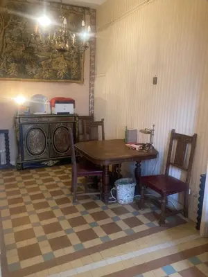 a dining room with a table and two chairs and a table and bench at Appartement dans le Vieux-Nice in Nice